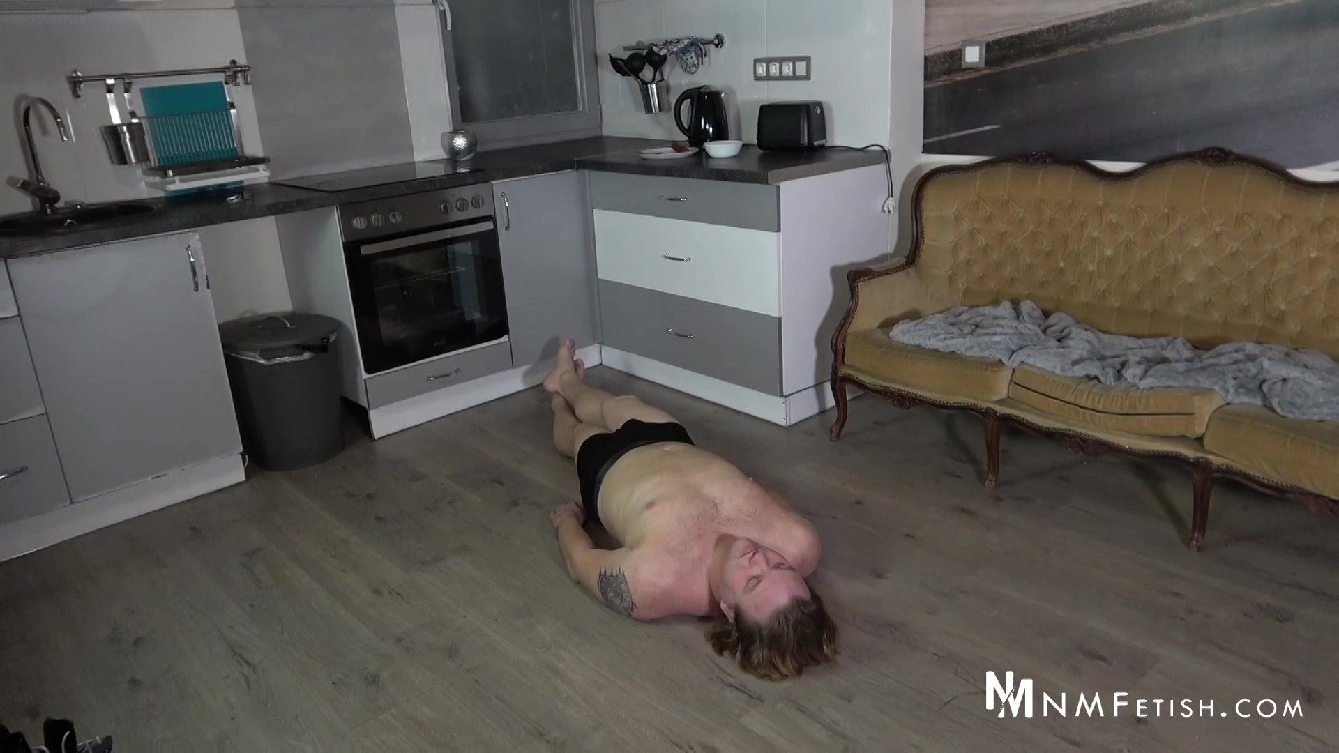 Cruel domina in high-heeled boots smothers her slave